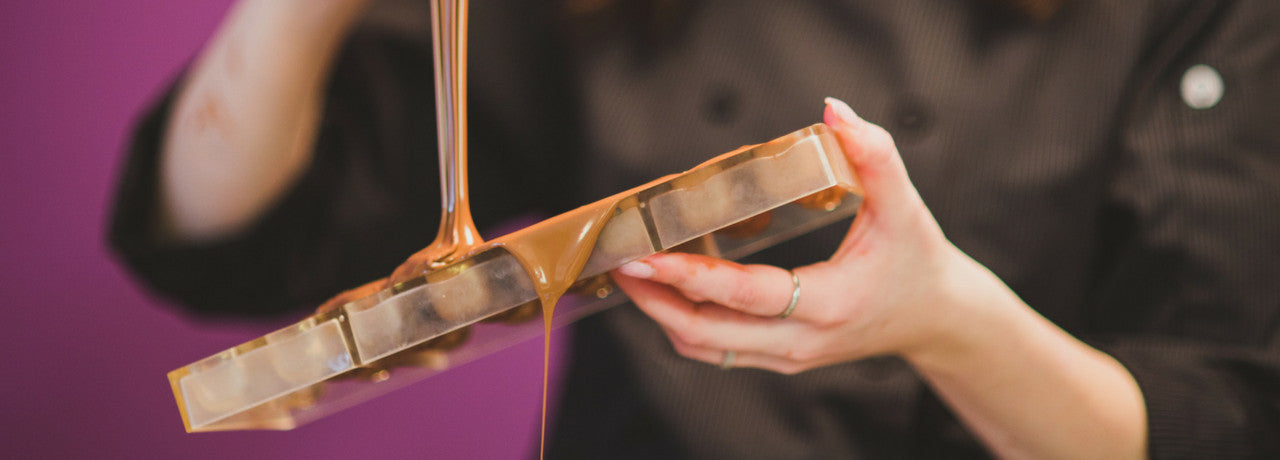 chocolate being poured into mould by The Violet Chocolate Company head chocolatier Rebecca